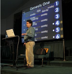 Chris Ashcraft speaking with PowerPoint