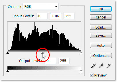 Dragging the Midtone slider to the left to brighten the image.