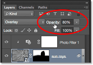 Lowering the opacity of the sun rays layer. 