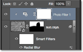 The Photo Filter adjustment layer is clipped to the sun rays layer below it. 